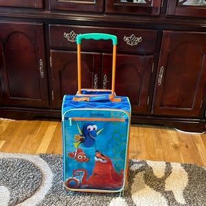 Child Finding Dory carryon American tourister suitcase